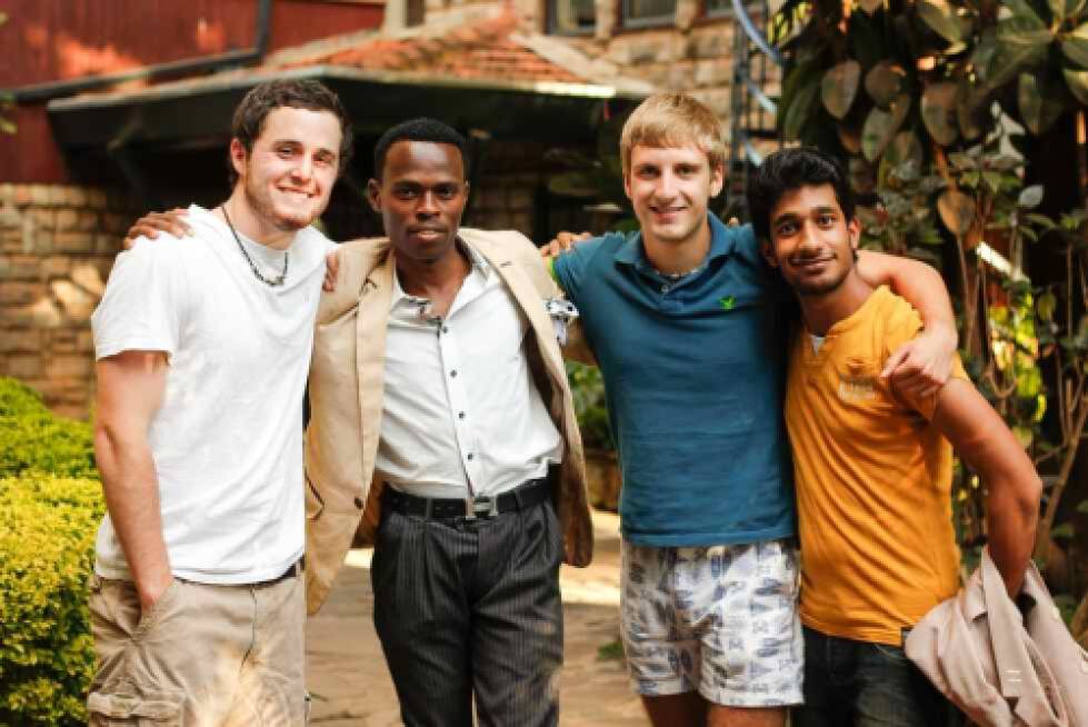 4 students smiling together in Kenya